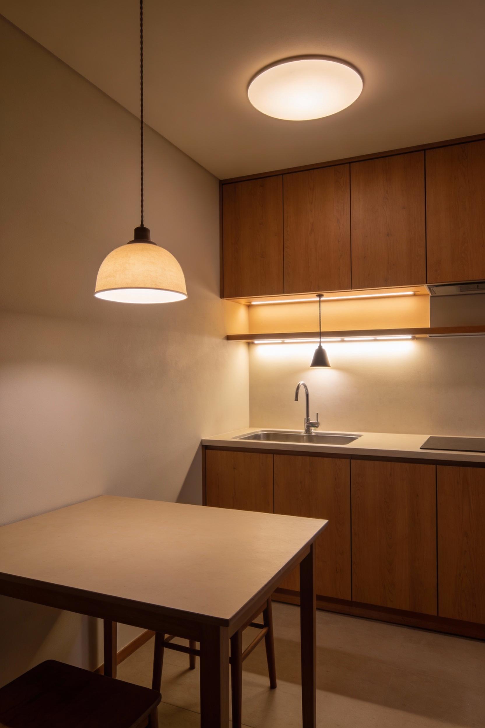 10) A cozy lighting plan that supports minimal kitchen design